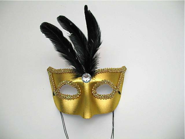 gold masquerade mask with feather